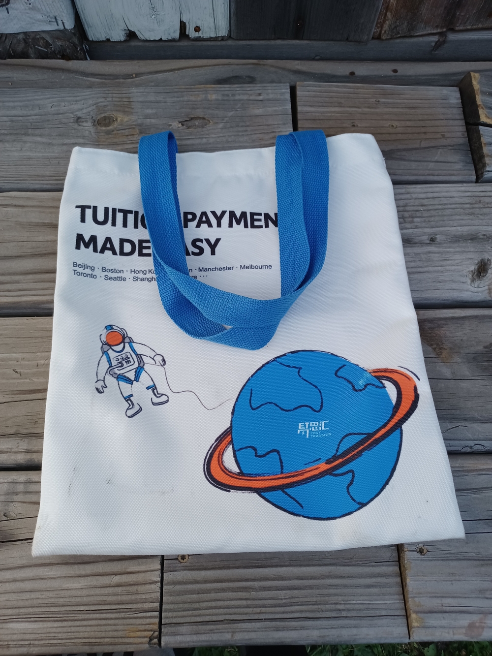White Canvas Tote with Blue Handles and Space Graphic